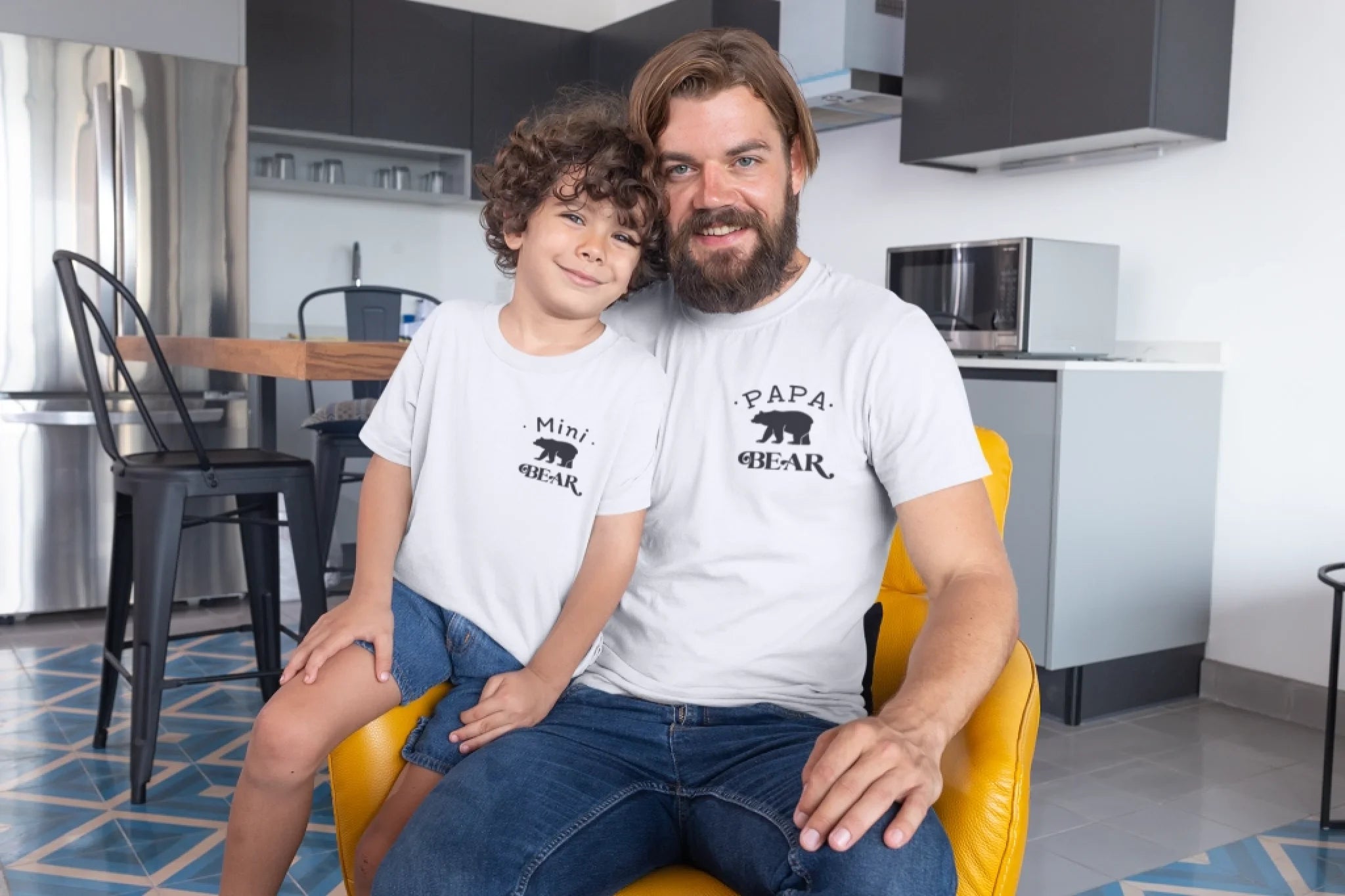 mockup-of-a-dad-and-his-son-wearing-t-shirts-at-home-28057 (1)